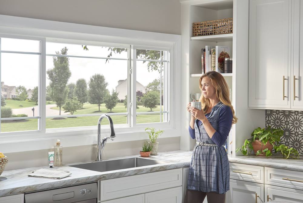 woman looking out vinyl window