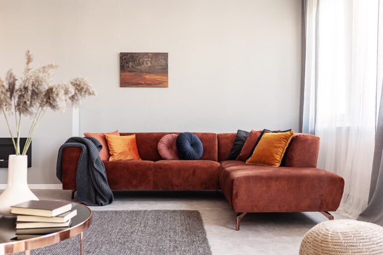 red couch with velvet pillows